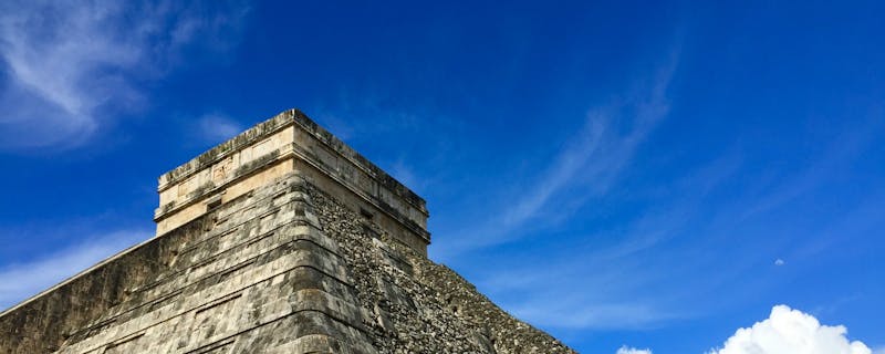 A photograph of an ancient stone pyramid in Chichén Itzá, Mexico.