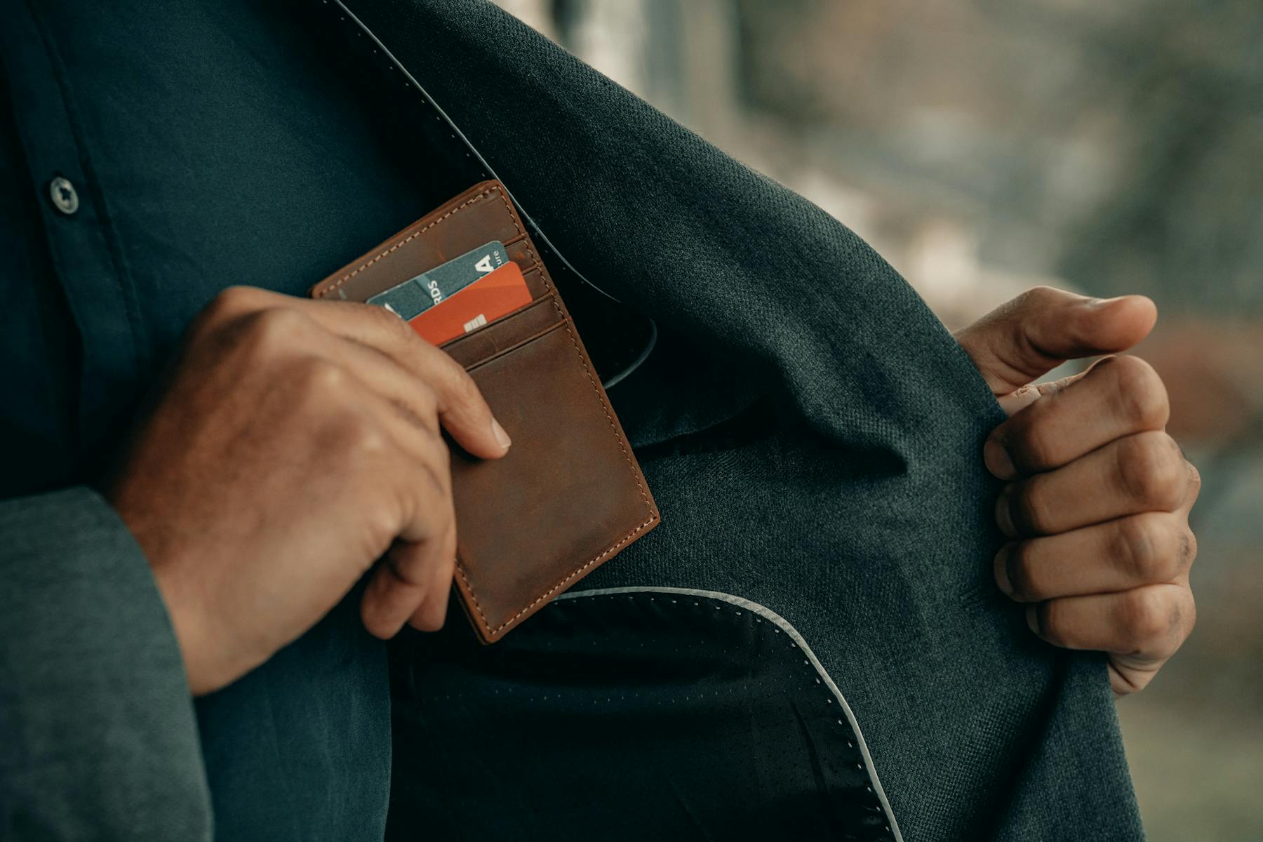 debit credit card man suit pocket