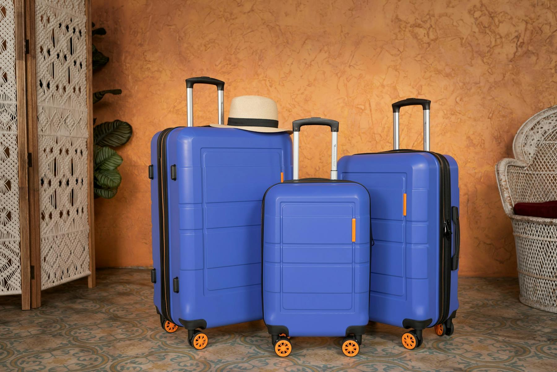 Three pieces of blue luggage sitting next to each other.
