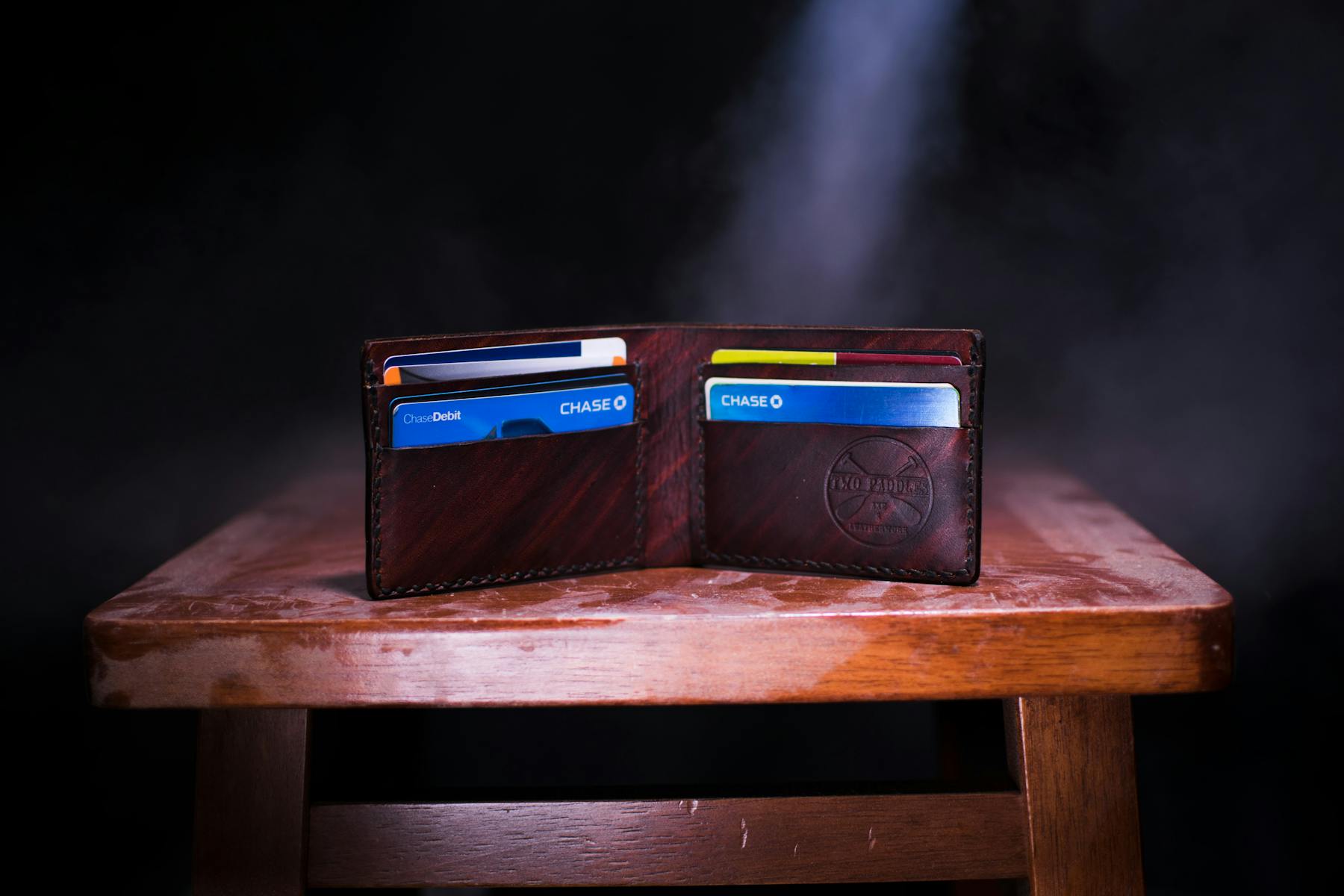 Cards in an open bi-fold leather wallet