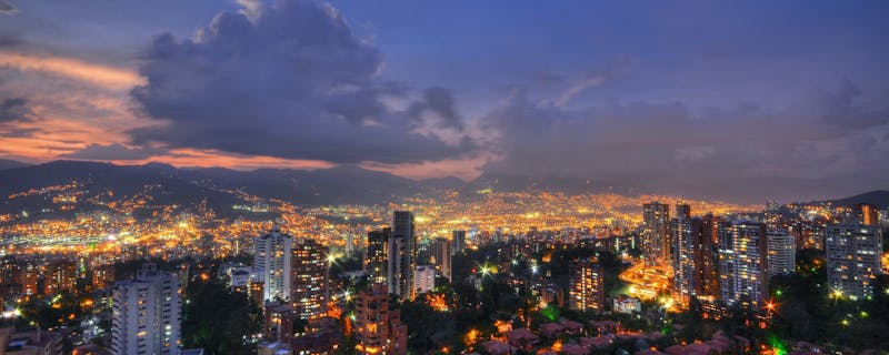 A view over the city skyline at night in Medellín, Colombia.