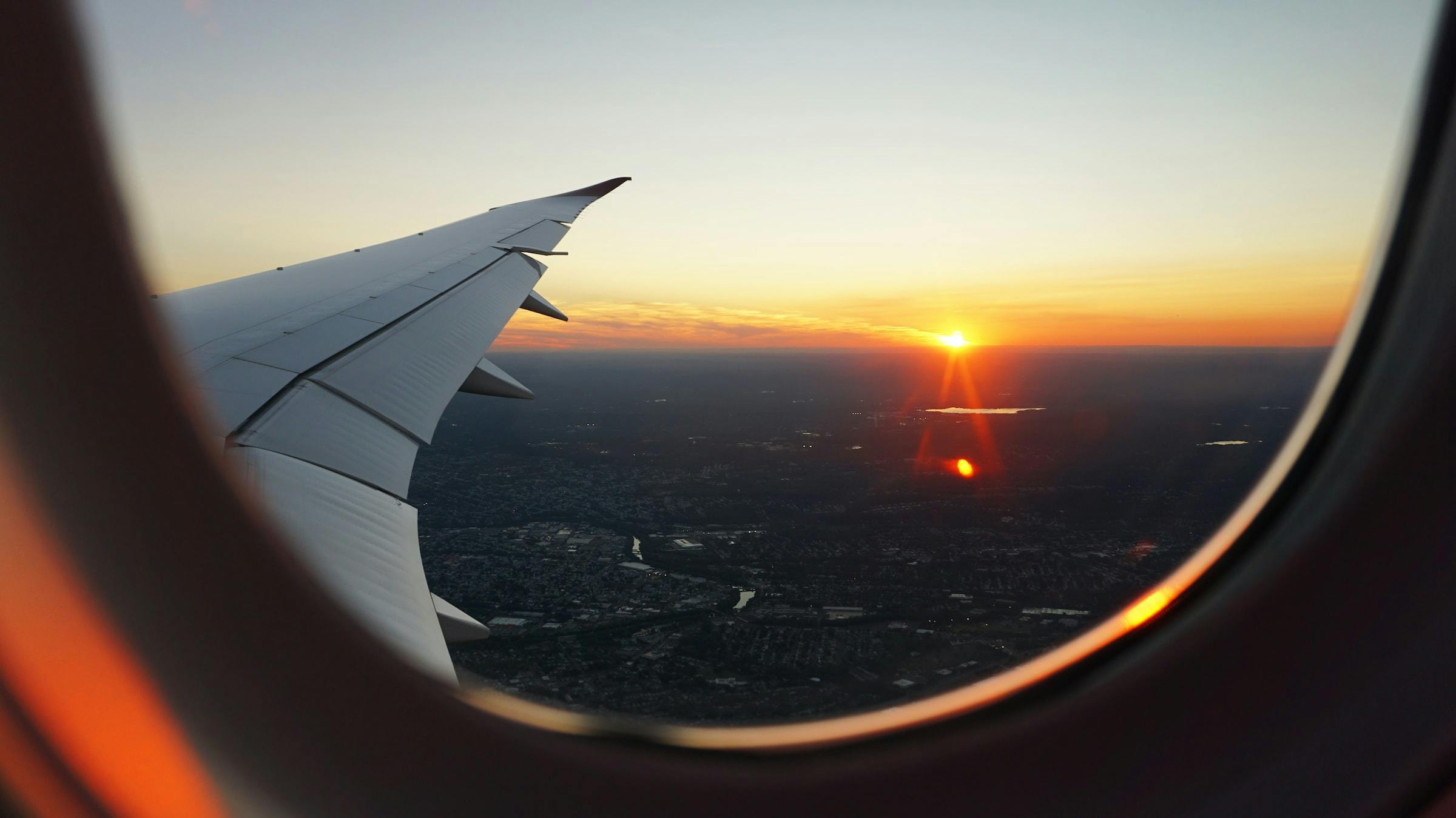 Sunset seen from the window seat of a plane